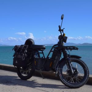 a bicycle is parked next to a body of water