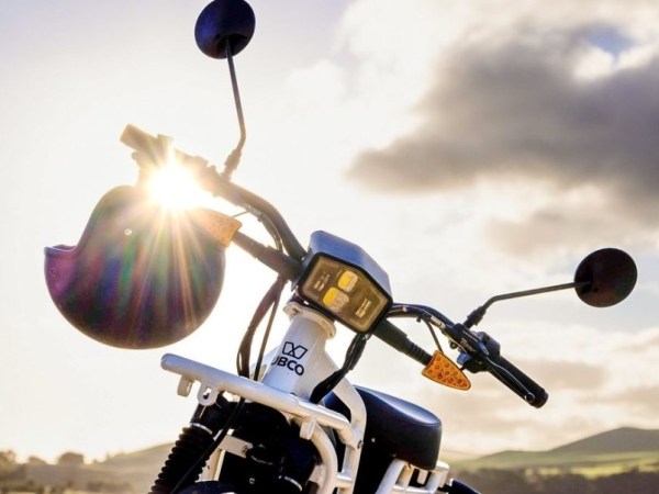 a person riding on the back of a motorcycle