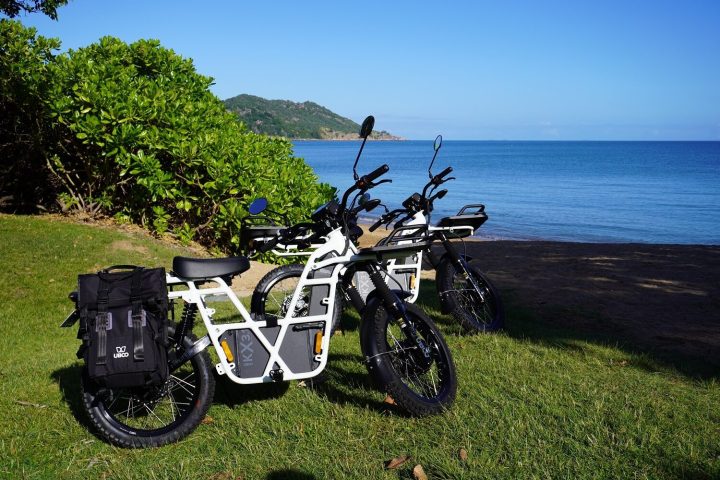 a bicycle is parked next to a body of water