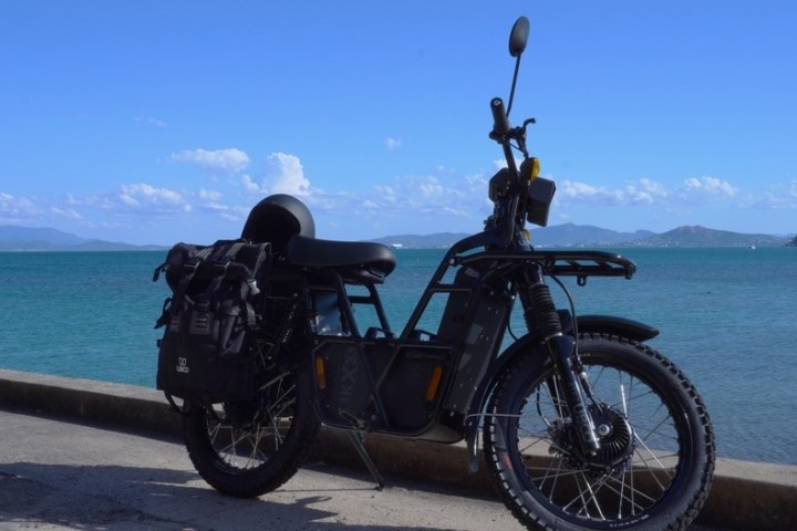 a bicycle is parked next to a body of water