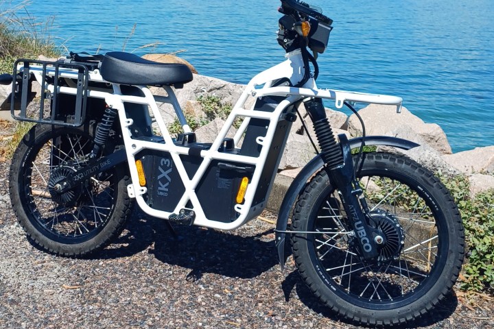 a motorcycle parked on the side of the ocean