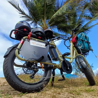 a motorcycle is parked on the side of a dirt field