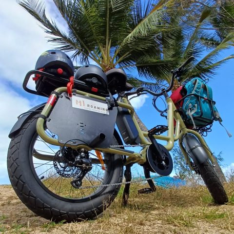a motorcycle is parked on the side of a dirt field