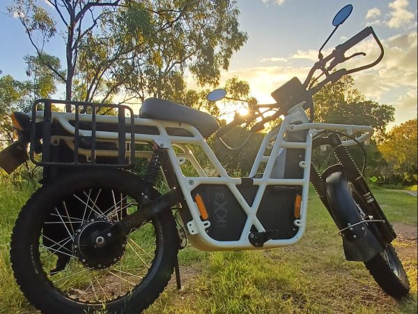 a motorcycle parked in a grassy field