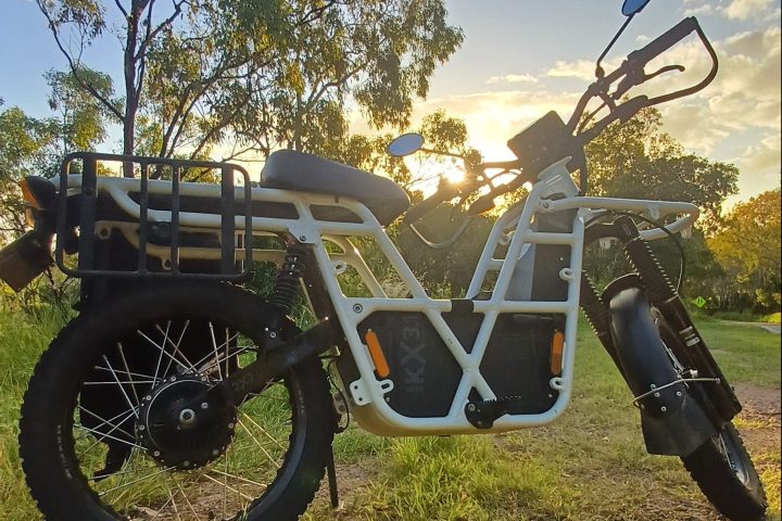 a motorcycle parked in a grassy field
