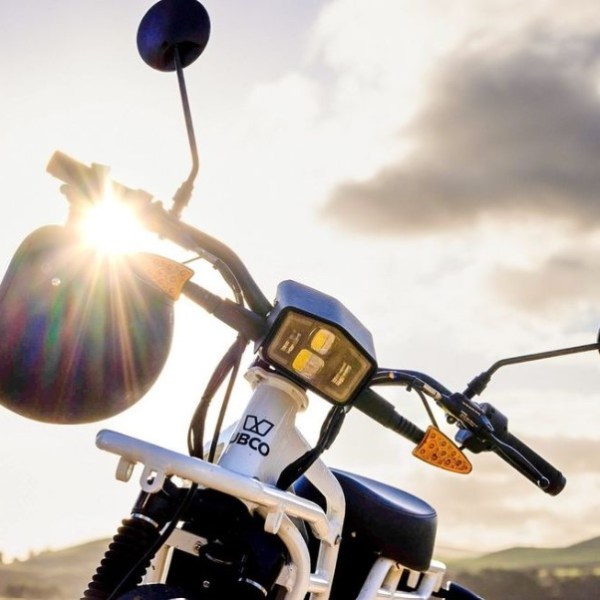 a person riding on the back of a motorcycle