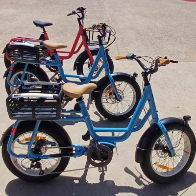 a bicycle is parked next to a blue motorcycle